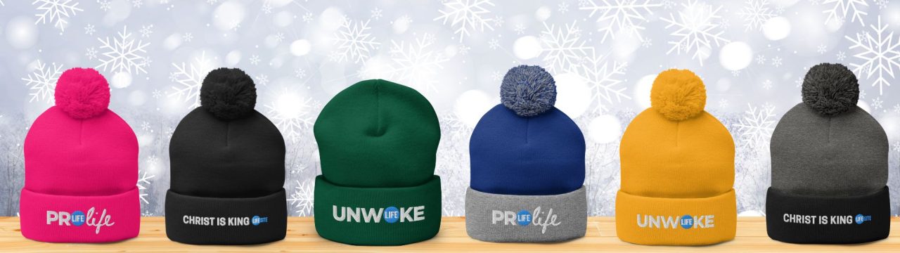 Six beanies displaying the phrases "Pro Life", "UNWOKE", and "Christ is King" in various colors arranged neatly on a flat surface.